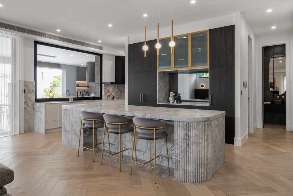 Stunning kitchen benchtop with a flawless vein matche flute to the island stone benchtop.