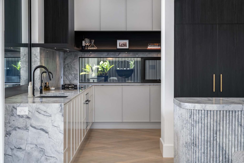 Marble kitchen by Uniq Stone, featuring Super White Dolomite for the kitchen benchtops, splashbacks and island marble benchtop with vein matched.